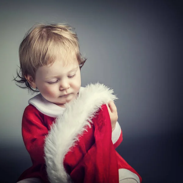 Criança com panos de santa — Fotografia de Stock