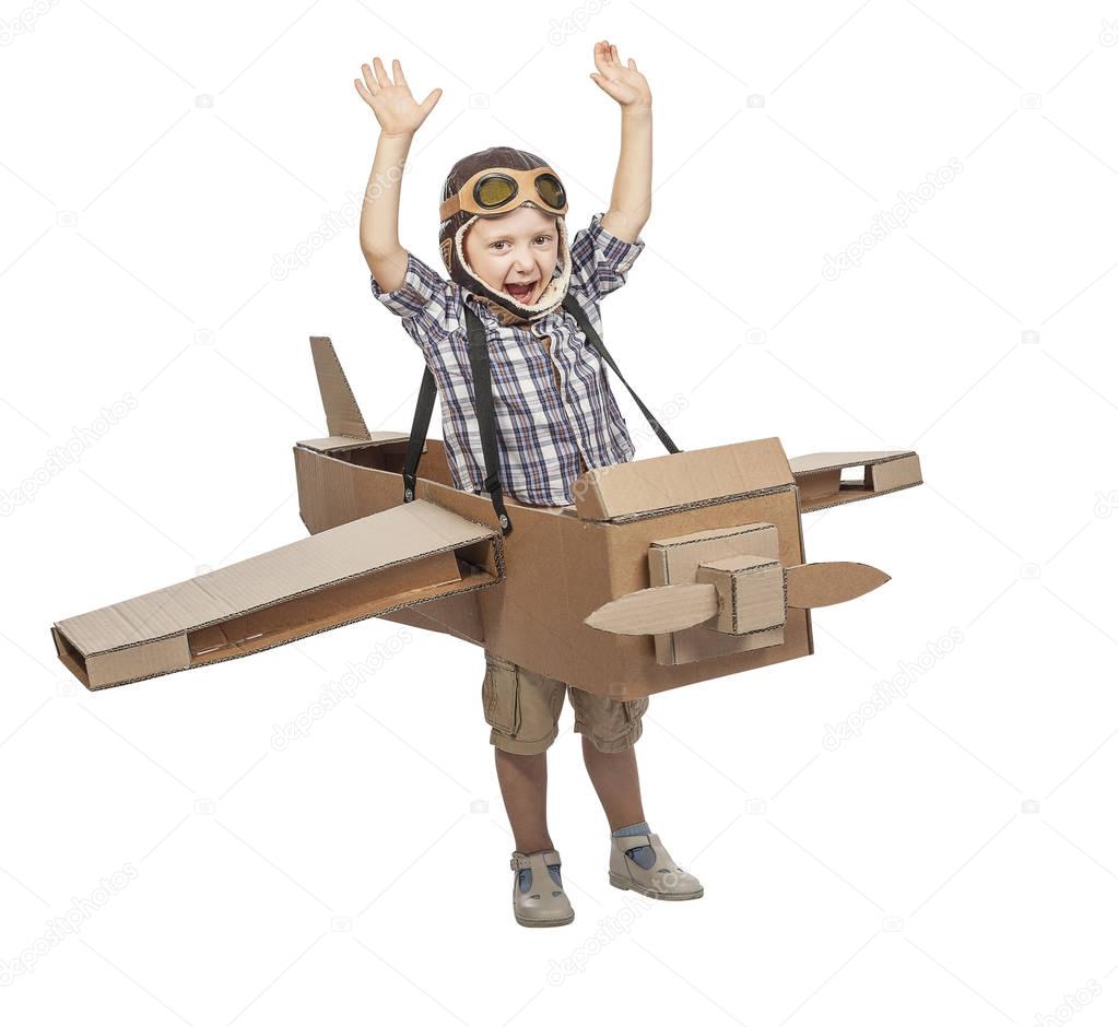 child with cardboard airplane