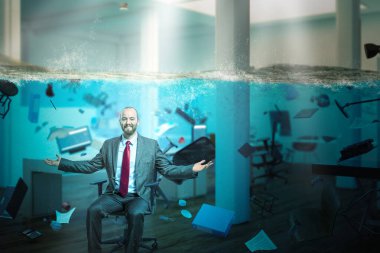 smiling businessman sitting in an office completely flooded  clipart