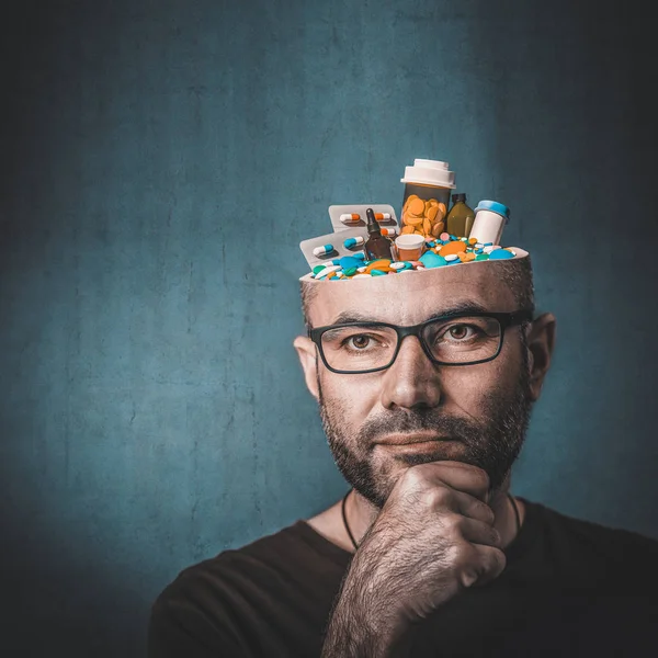 Portrait of man with pills in his head — Stock Photo, Image