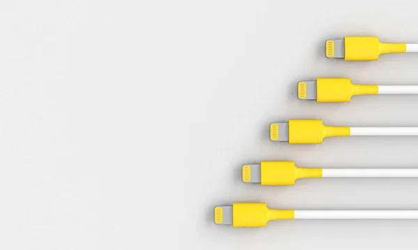 Žlutá a bílá USB kabel na šedém pozadí. — Stock fotografie