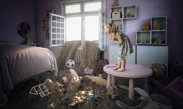 3-year-old Caucasian blond girl frightened and standing on a small table sees mud entering her bedroom. concept of disaster and family problem.