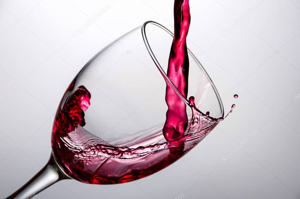 wine being pouring into a glass closeup