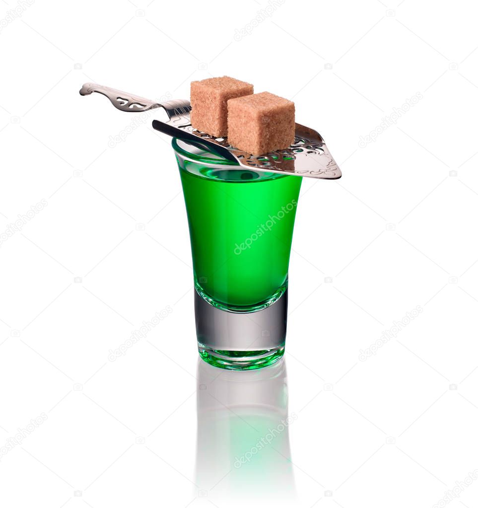 Absinthe shots with sugar and spoon isolated