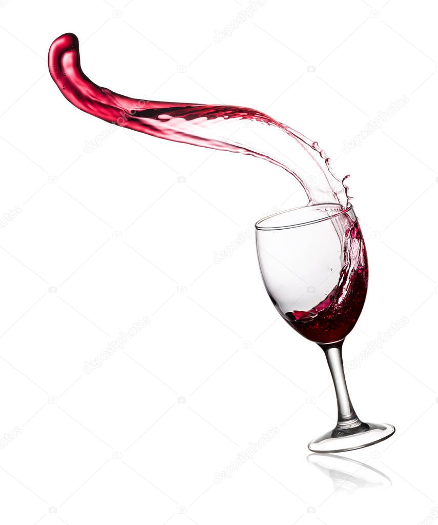 Glass of red wine with splashes