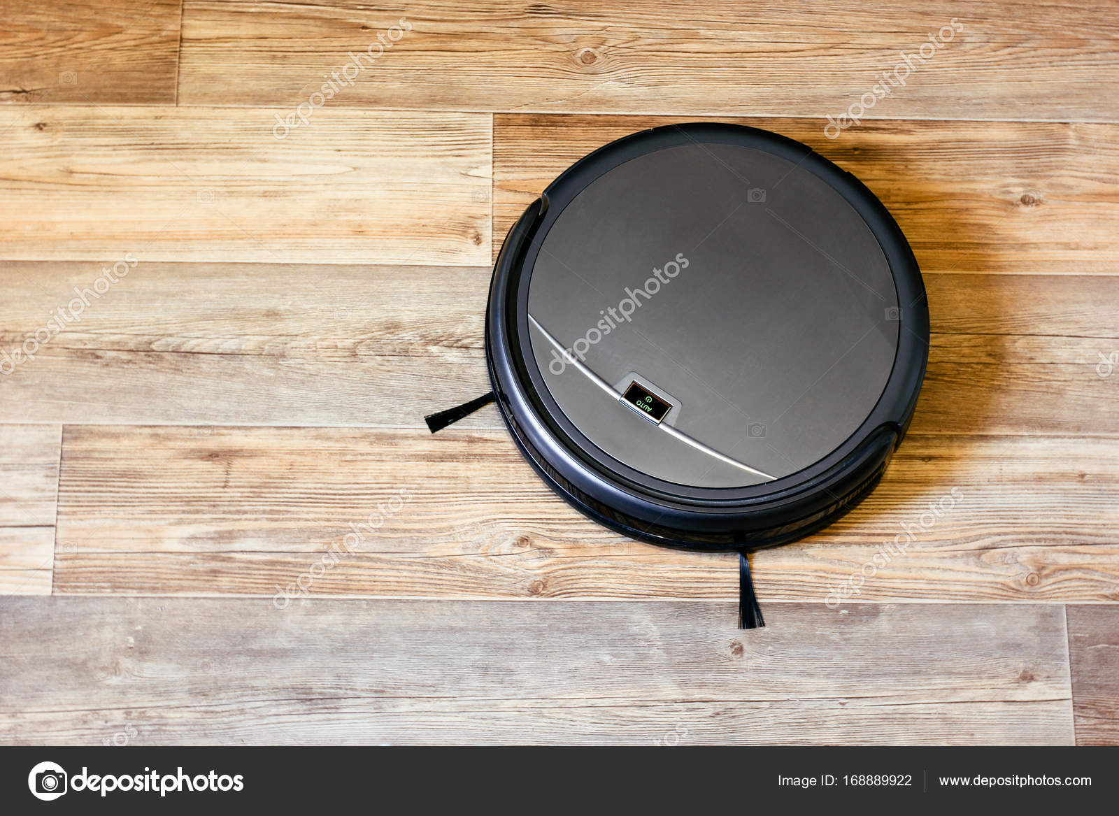 Robot Vacuum Cleaner On The Parquet Floor Stock Photo C Mpavlov