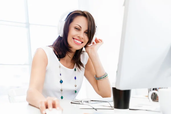 Woman in headphones — Stock Photo, Image