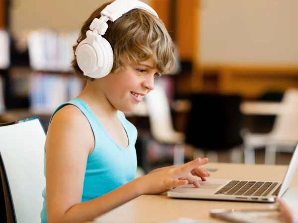 Boy spending time with notebook — Stock Photo, Image