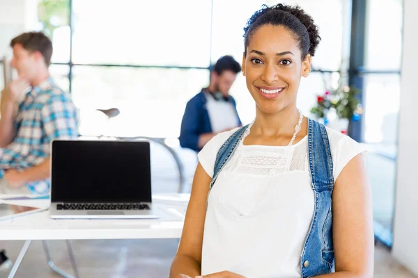 Portrait of smiling afro-american office worker sitting in offfice — Stock Photo, Image