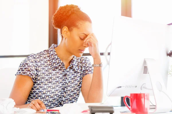 Portrait of tired afro-american office worker sitting in offfice — Stock Photo, Image