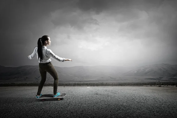 Girl ride skateboard . Mixed media — Stock Photo, Image