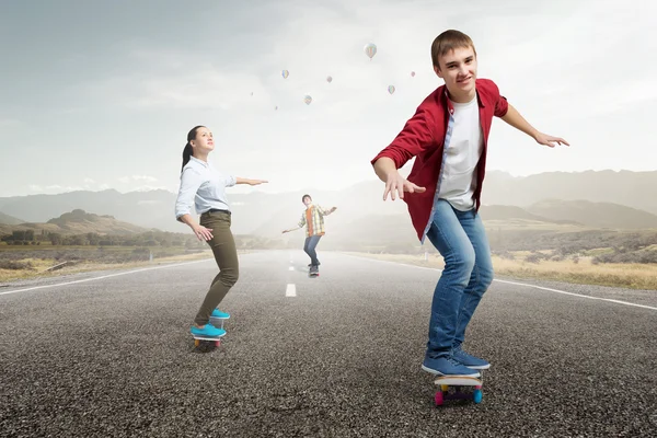 Teenagers ride skateboards . Mixed media — Stock Photo, Image