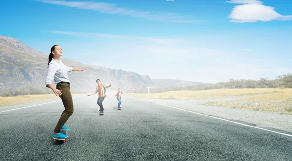 Teenagers ride skateboard . Mixed media — Stock Photo, Image