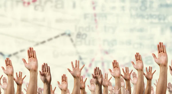 Grupp människor med upphöjda händer. Mixed media — Stockfoto