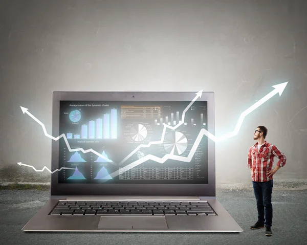 Guy and big laptop . Mixed media — Stock Photo, Image