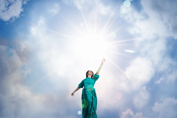 Woman levitating in sky . Mixed media — Stock Photo, Image