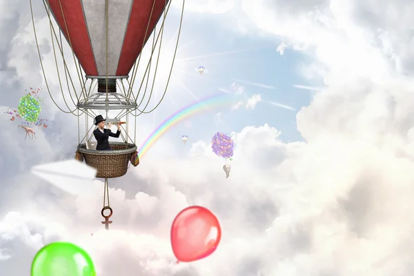 Woman traveling in aerostat . Mixed media — Stock Photo, Image