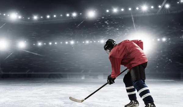 Hockey player on the ice . Mixed media — Stock Photo, Image