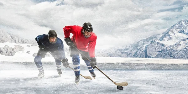 Playing hockey game . Mixed media — Stock Photo, Image