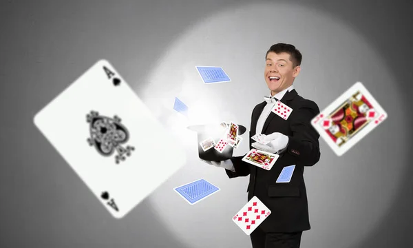 Businessman demonstrating magic . Mixed media — Stock Photo, Image