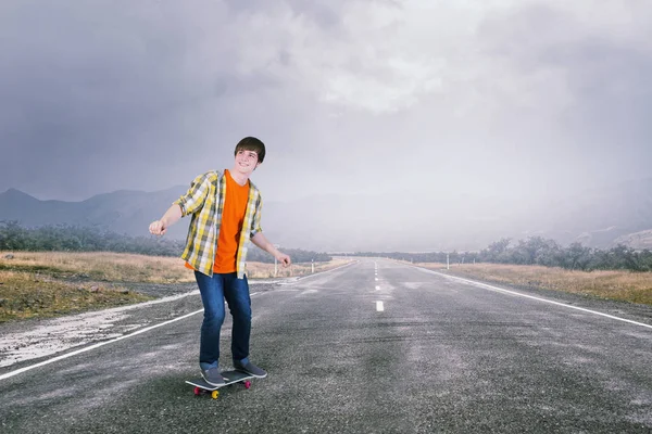 Boy ride skateboard . Mixed media — Stock Photo, Image