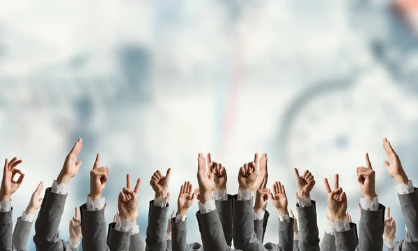 Gruppe von Menschen mit erhobenen Händen. Gemischte Medien — Stockfoto