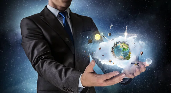 Whole world in his hands . Mixed media — Stock Photo, Image