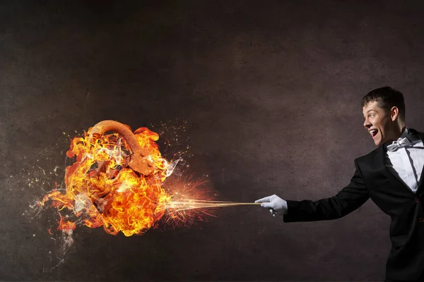 Businessman demonstrating magic . Mixed media — Stock Photo, Image