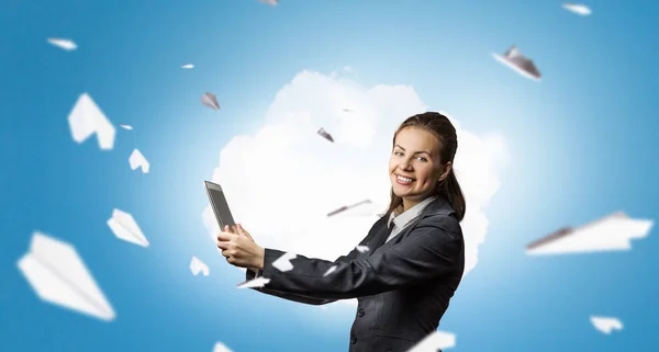 Businesswoman with tablet pc . Mixed media — Stock Photo, Image