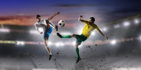 Soccer palyers fighting for ball . Mixed media — Stock Photo, Image