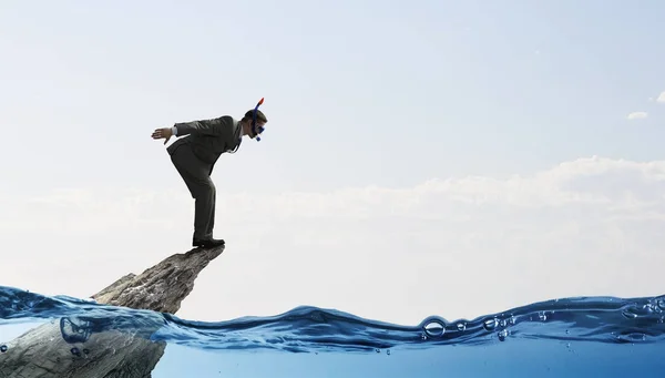 Businessman diving from top . Mixed media — Stock Photo, Image