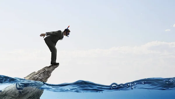 Affärsman dykning från toppen. Mixed media — Stockfoto