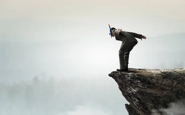 Affärsman dykning från toppen. Mixed media — Stockfoto