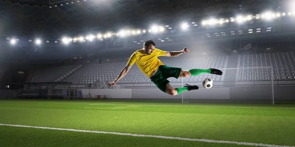 Soccer player kicking ball . Mixed media — Stock Photo, Image