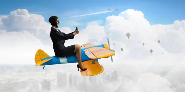 Woman in drawn airplane . Mixed media — Stock Photo, Image