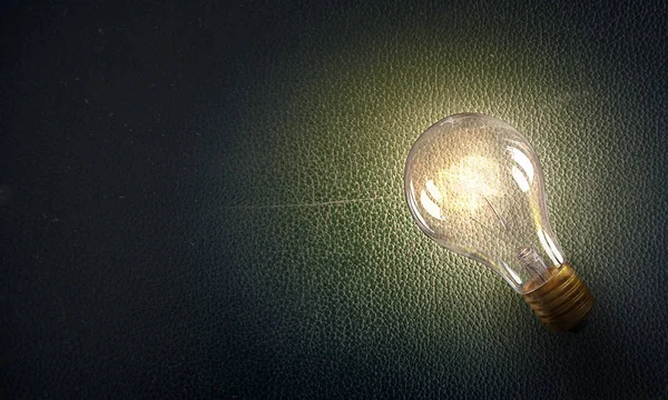 Электрическая лампочка на текстуре. Смешанные медиа — стоковое фото