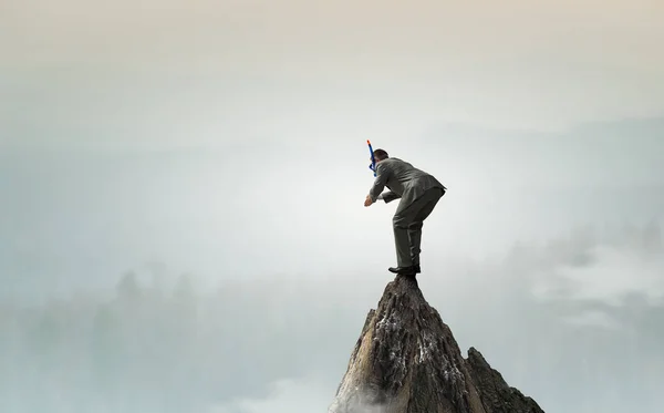 Affärsman dykning från toppen. Mixed media — Stockfoto