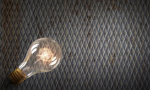 Electric bulb on texture . Mixed media — Stock Photo, Image