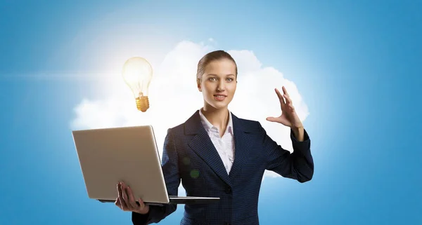 Woman with laptop in hands . Mixed media — Stock Photo, Image