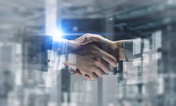 Partners shaking hands . Mixed media — Stock Photo, Image