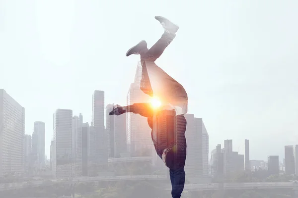 B-boy performing some moves . Mixed media — Stock Photo, Image