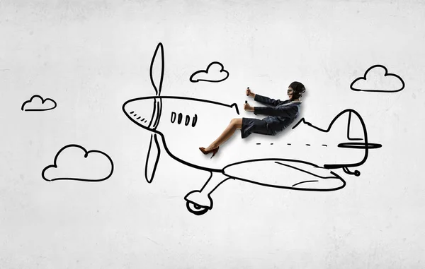 Woman pilot in drawn airplane . Mixed media — Stock Photo, Image