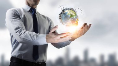 Tüm dünya onun ellerinde. Karışık ortam