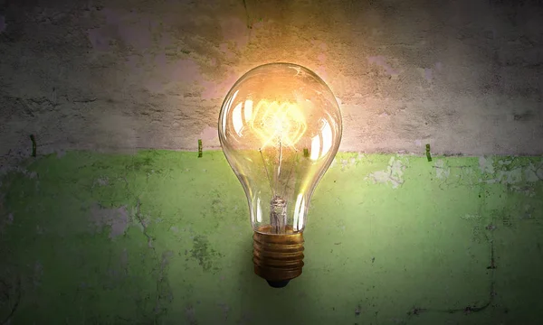 Electric bulb on texture . Mixed media — Stock Photo, Image