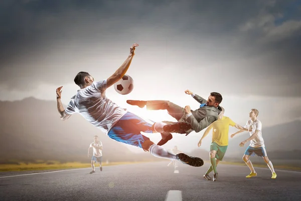 Soccer player kicking ball . Mixed media — Stock Photo, Image