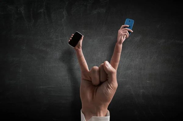 Rock gesture on concrete background . Mixed media — Stock Photo, Image