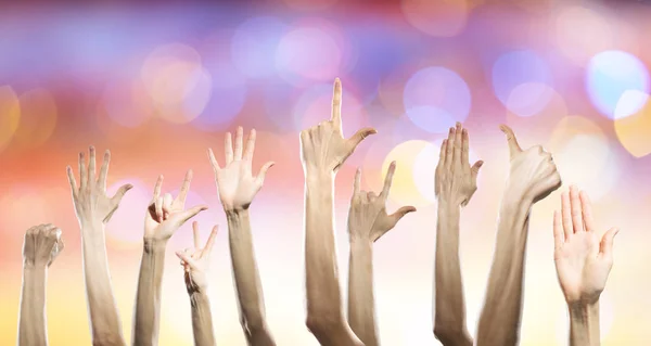 Group of people rise hands . Mixed media — Stock Photo, Image