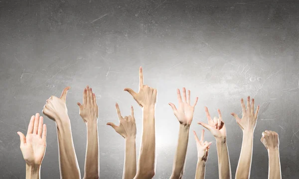 Group of people rise hands . Mixed media — Stock Photo, Image