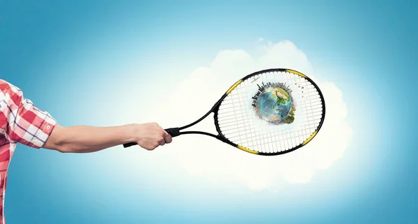 Racket in person hand . Mixed media — Stock Photo, Image