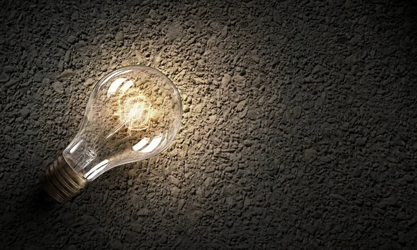 Lampadina elettrica su texture. Mezzi misti — Foto Stock